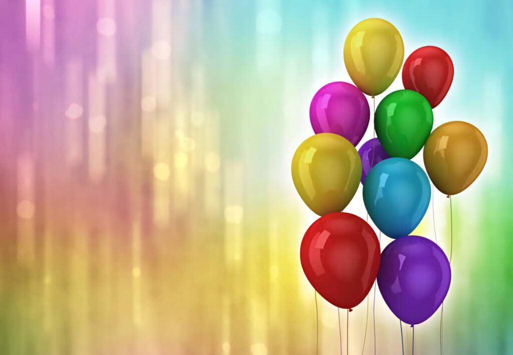 Colorful balloons floating against pastel sky background celebrating joy and flight wallpaper