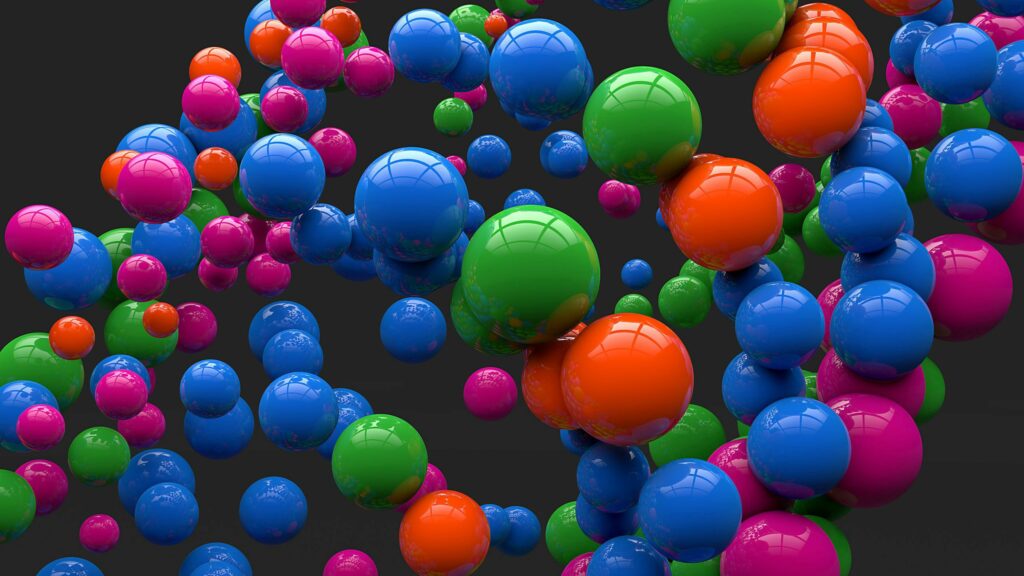 Vibrant Colorful Balls in Motion on Dark Background Wallpaper