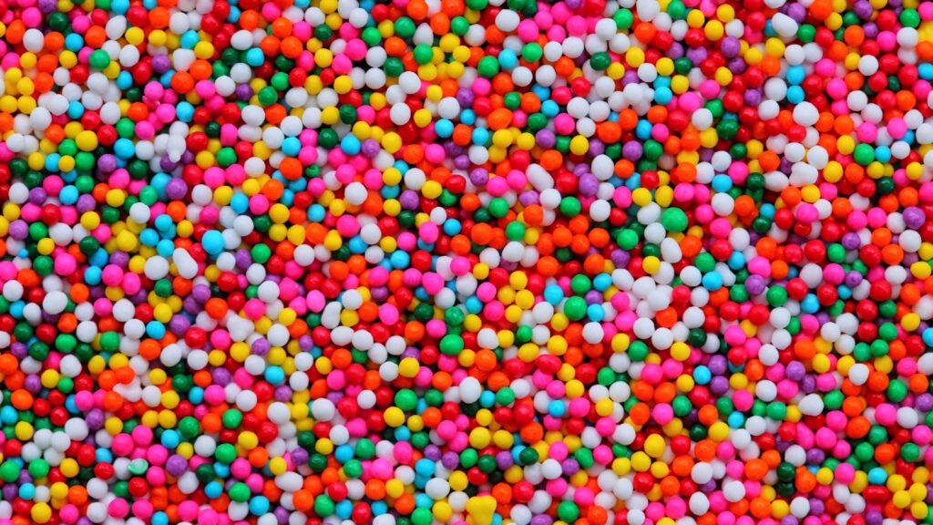 Close-up of colorful candy balls wallpaper vibrant sweet background with bright playful hues