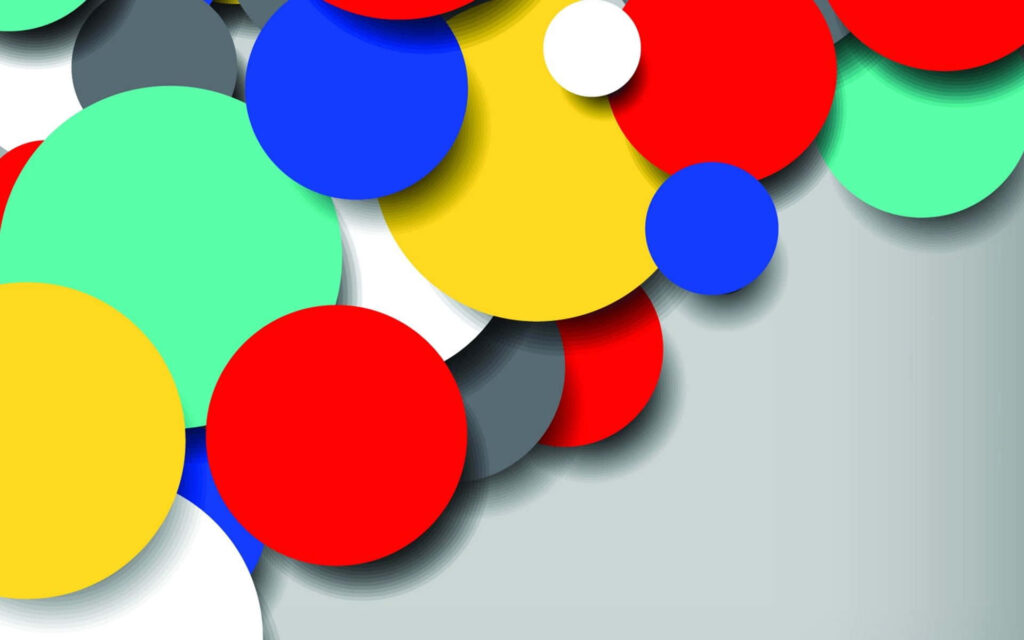 Vibrant colorful circles wallpaper with red blue yellow green on soft gray background abstract design