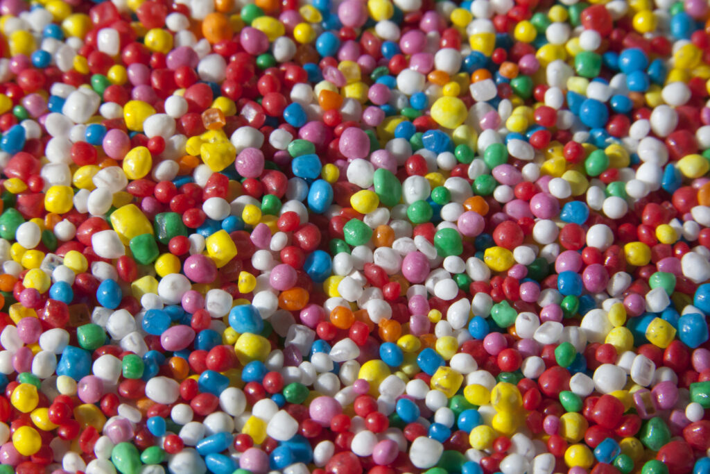 Vibrant Dragee Sweets Wallpaper: Colorful Shapes & Hues for Decor