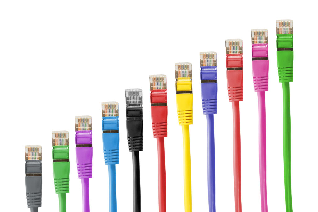 Colorful Ethernet cables in a row on white background glossy connectors tech wallpaper design