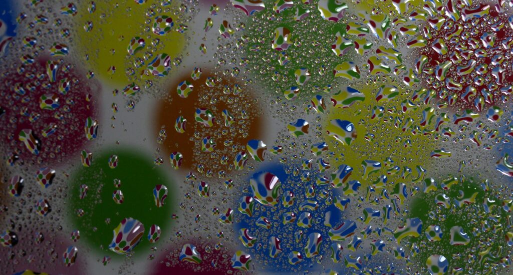 Vibrant Water Droplet Wallpaper: Colorful Circular Shapes Background