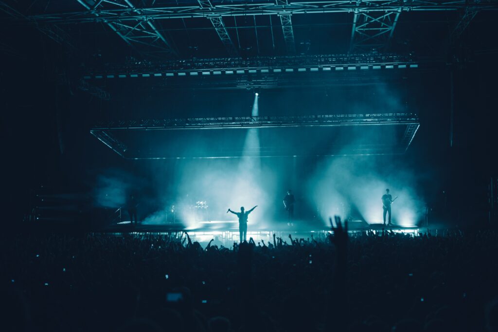 Vibrant Concert Wallpaper: Live Performance with Dramatic Stage Lights