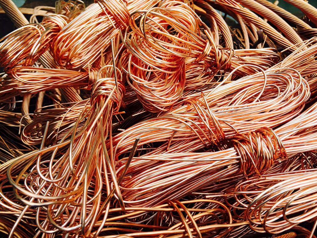 Vibrant twisted copper wires wallpaper with rich metallic tones perfect for tech backgrounds
