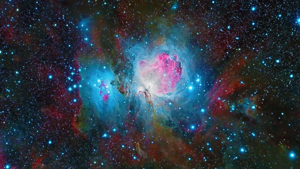 Colorful nebula in vibrant outer space with shining stars and cosmic elements wallpaper.
