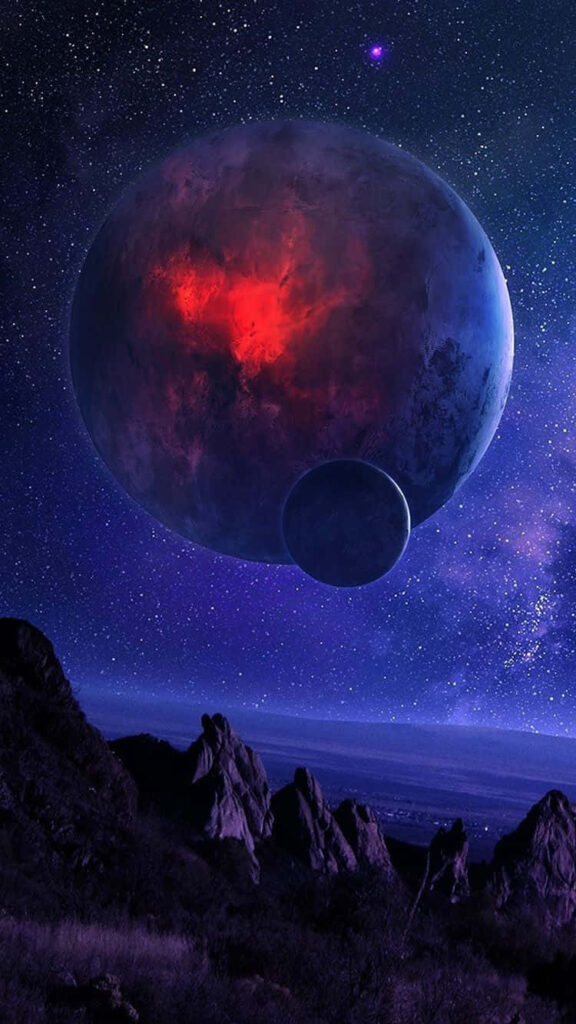 Vibrant Cosmic iPhone Wallpaper: Glowing Planet & Starry Mountains