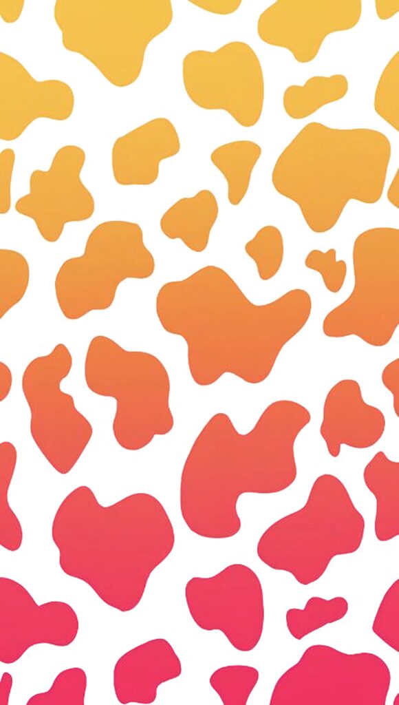 Vibrant cow print wallpaper with abstract yellow orange pink spots on white background modern design