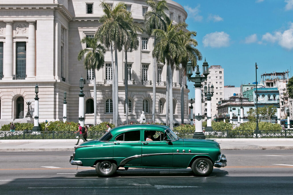 Cuban Wallpaper: Classic Green Car & Historic Architecture Background