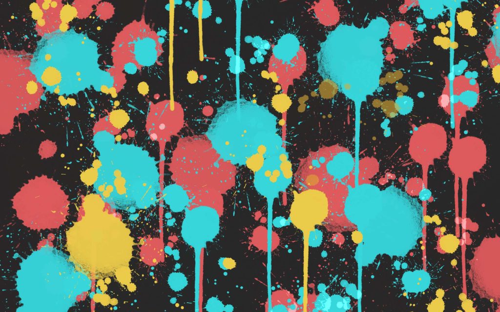 Colorful cyan pink and yellow paint drips on dark background abstract graffiti wallpaper design