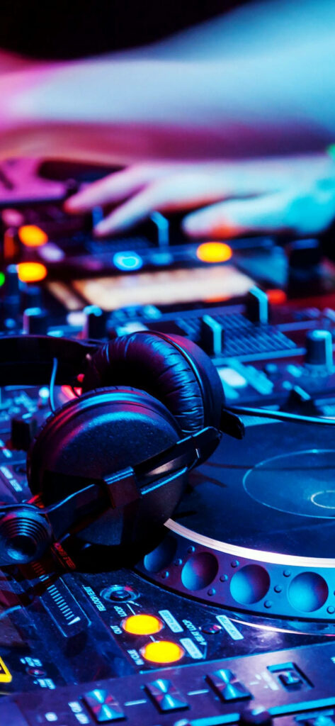 Vibrant DJ Booth Wallpaper: Colorful LED Lights & Club Atmosphere