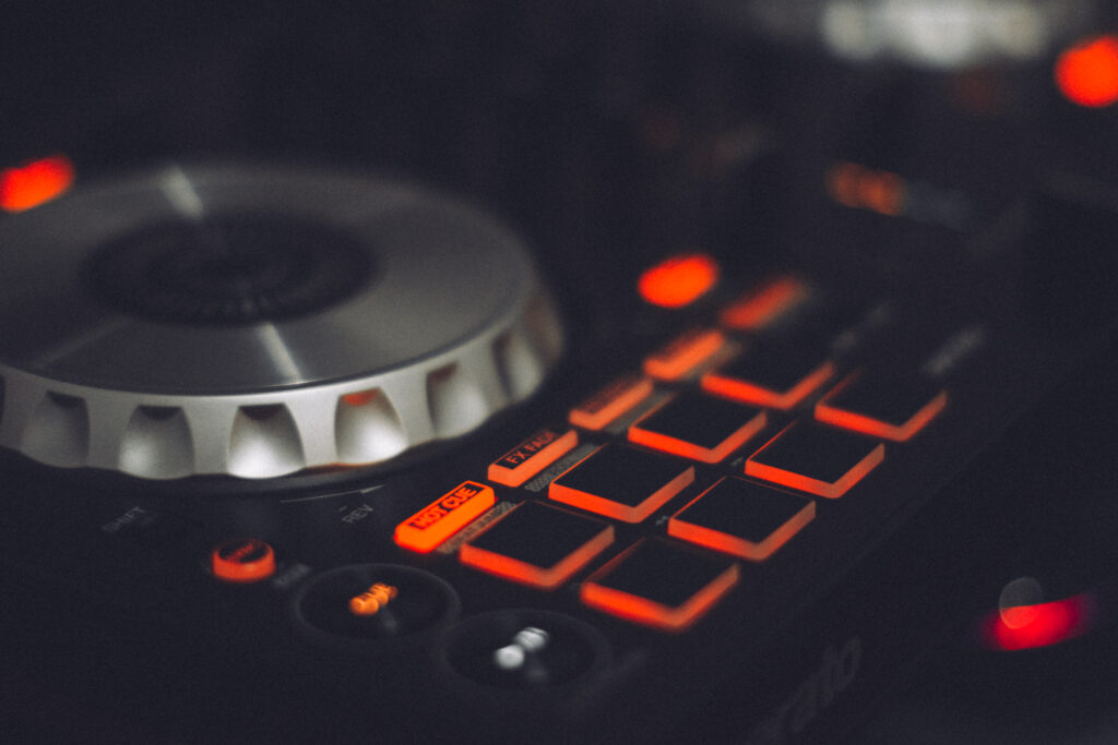 Vibrant DJ Console Wallpaper: Illuminated Buttons & Sleek Design