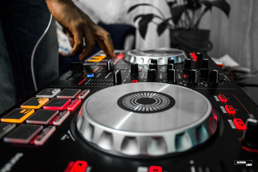 Vibrant DJ Console Wallpaper: Illuminated Controls & Music Energy