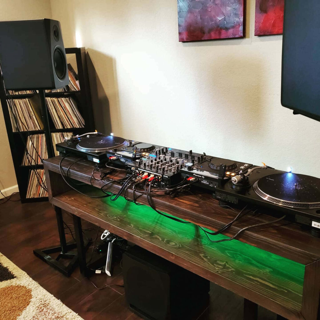 Vibrant DJ Home Studio: Professional Mixer, Turntables & Vinyl Display Wallpaper