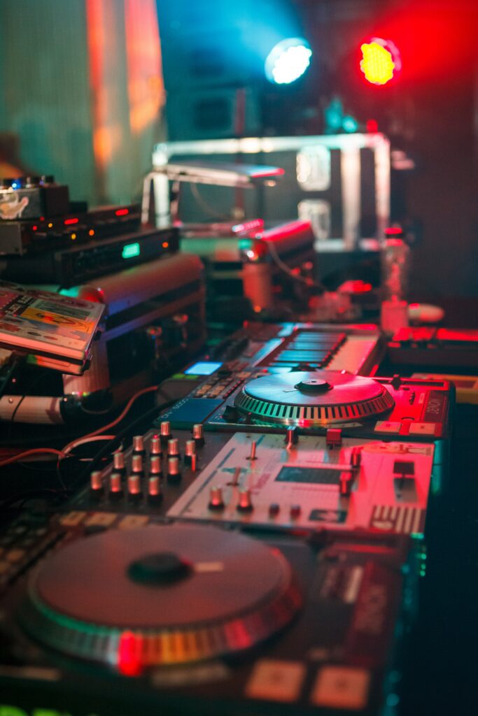 Vibrant DJ Setup Wallpaper: Turntables & Stage Lights Background