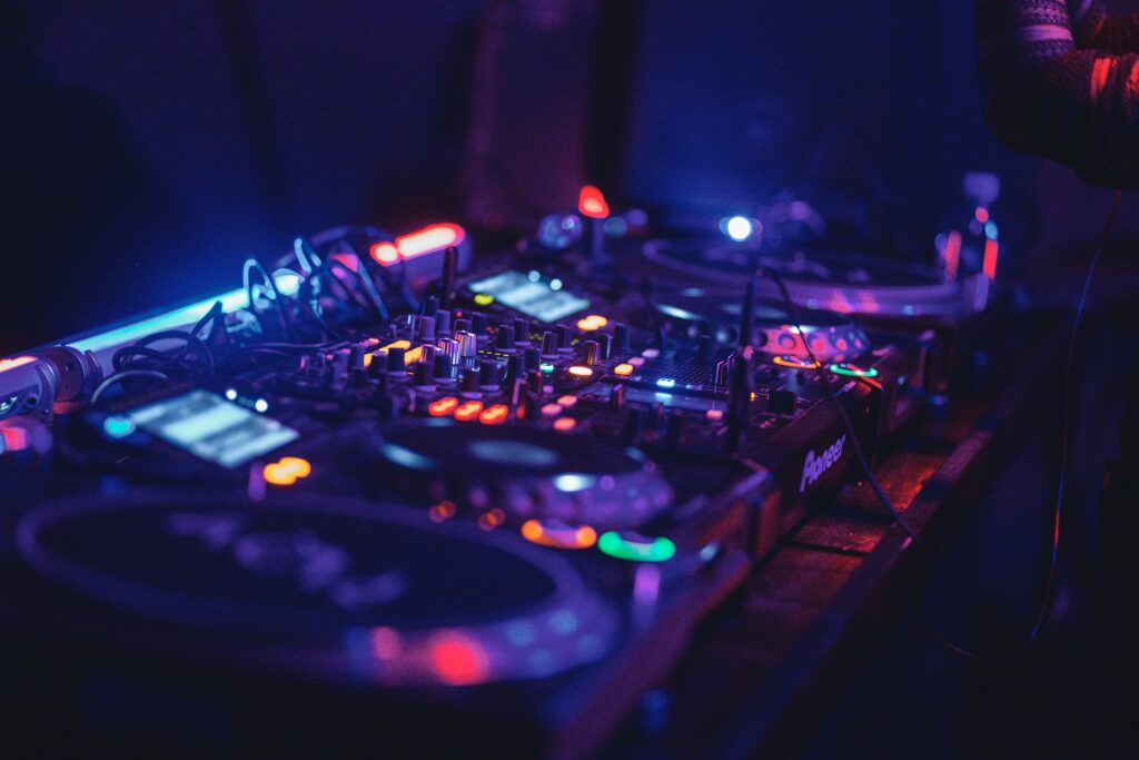 Vibrant DJ Setup Wallpaper: Neon Lights & Music Vibes Background