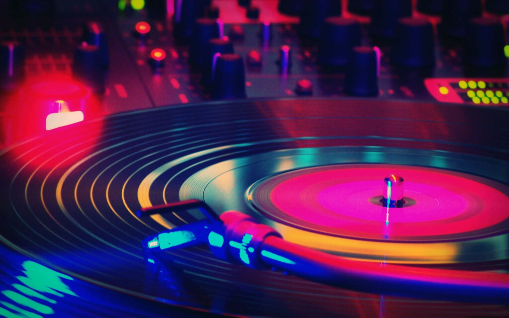 Colorful DJ Turntable Wallpaper: Energetic Party Atmosphere Background
