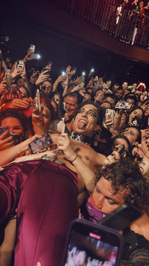 Vibrant Wallpaper of Damiano David Performing with Enthusiastic Fans