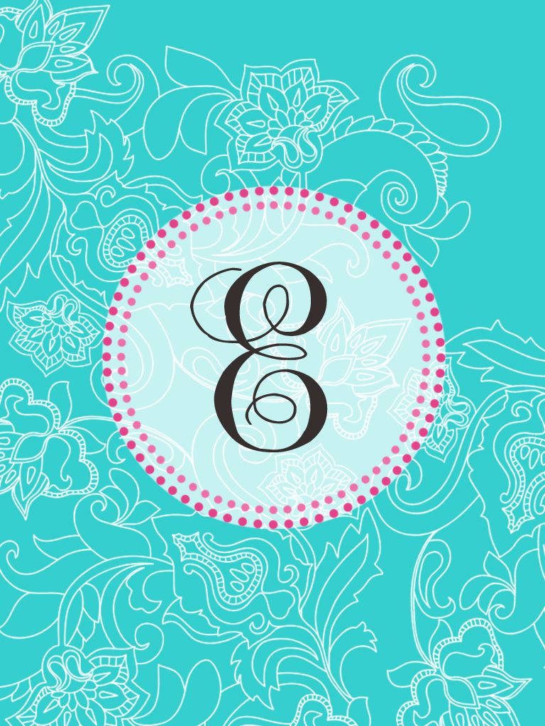 Dark cursive letter E in blue circle with pink polka dots on turquoise floral paisley background Wallpaper