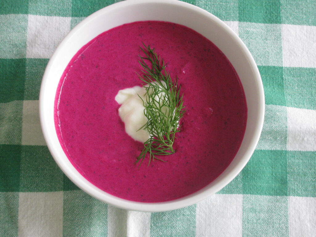Vibrant Dark Pink Borscht with Dill & Cream on Checkered Tablecloth Wallpaper