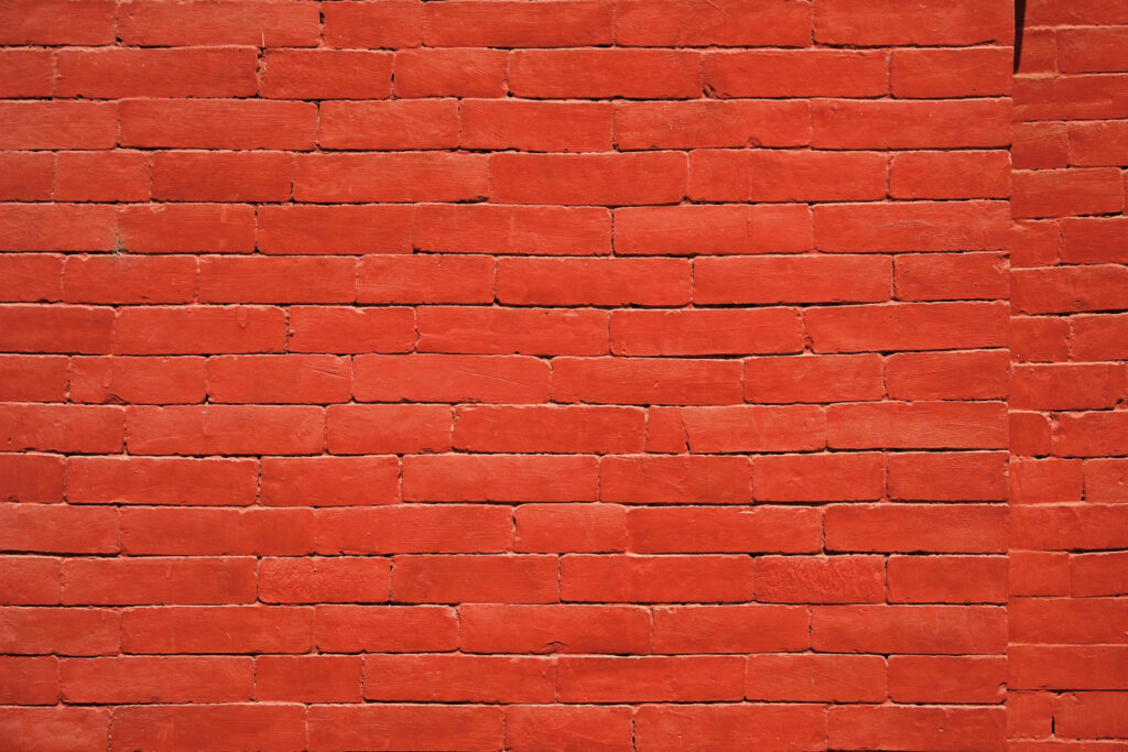 Vibrant Deep Crimson Red Brick Wallpaper: Rustic Classic Design