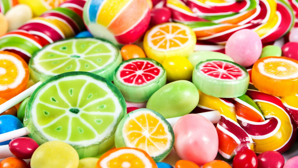 Vibrant Delights: A Captivating Snapshot of Colorful Citrus Candy Medley Wallpaper