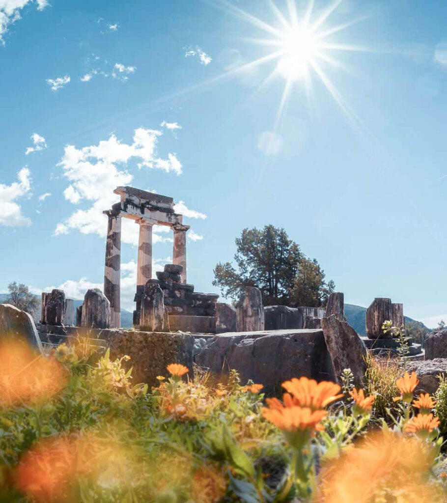 Delphi Ruins Wallpaper: Serene Historical Beauty Under Sunlit Skies