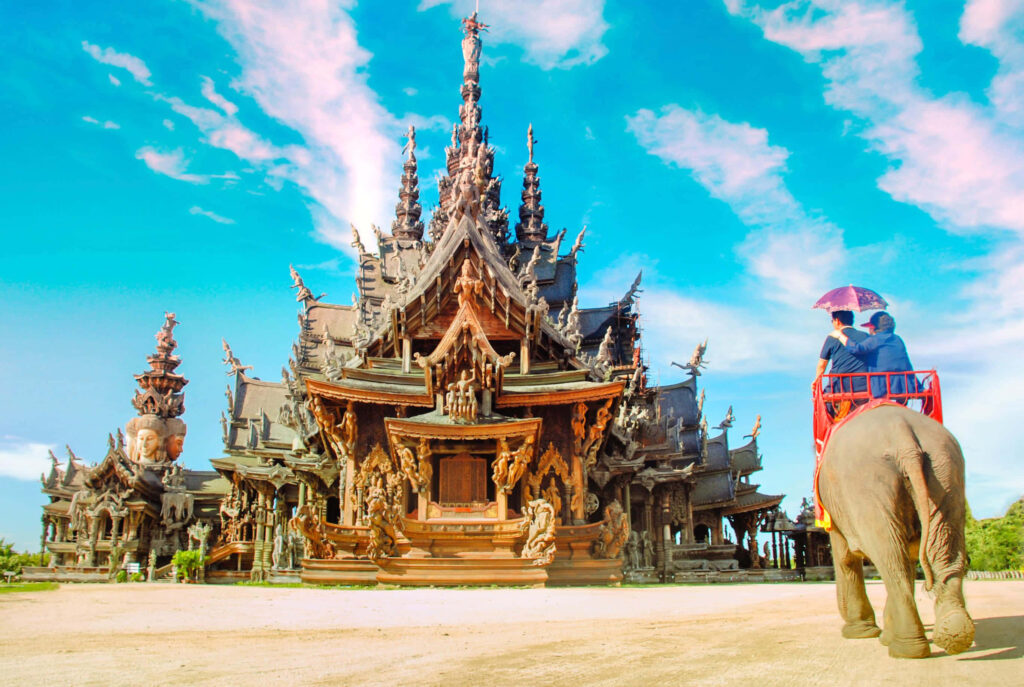 Majestic Sanctuary of Truth: Vibrant Wallpaper with Elephant Ride