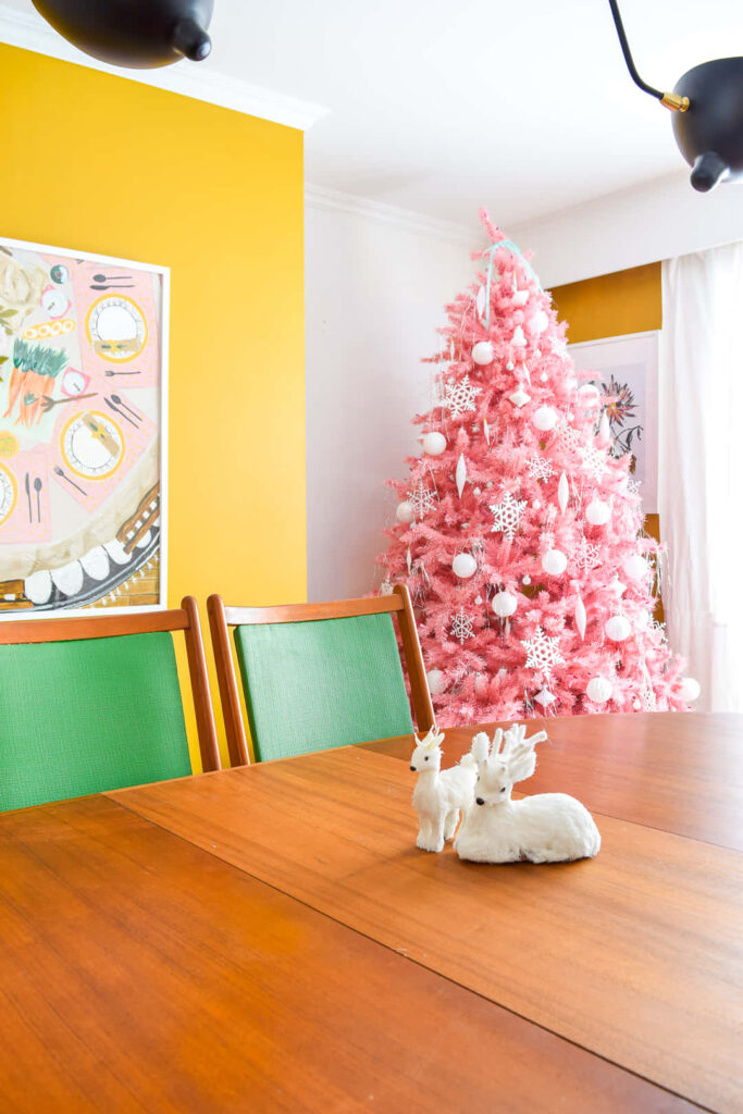 Vibrant Dining Room Wallpaper with Pink Christmas Tree & Warm Decor