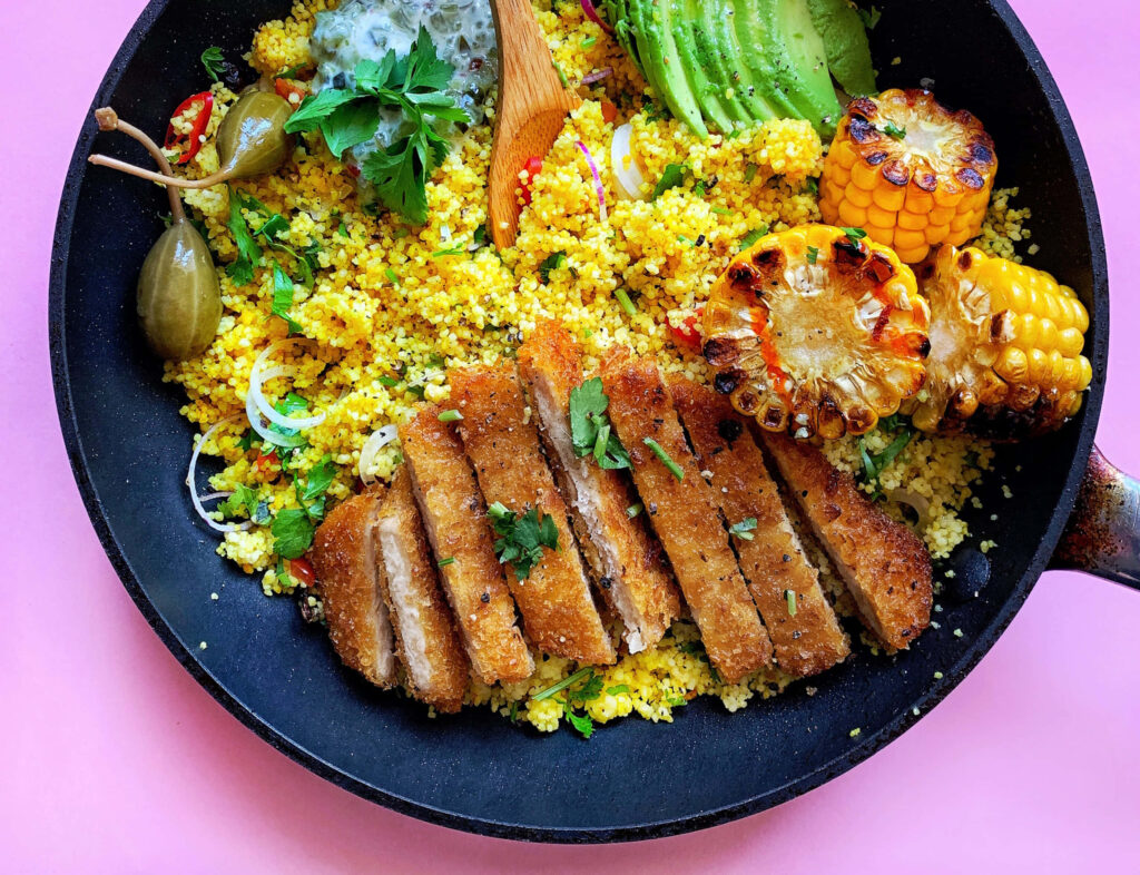 Vibrant Meal: Crispy Breaded Meat & Colorful Couscous Wallpaper