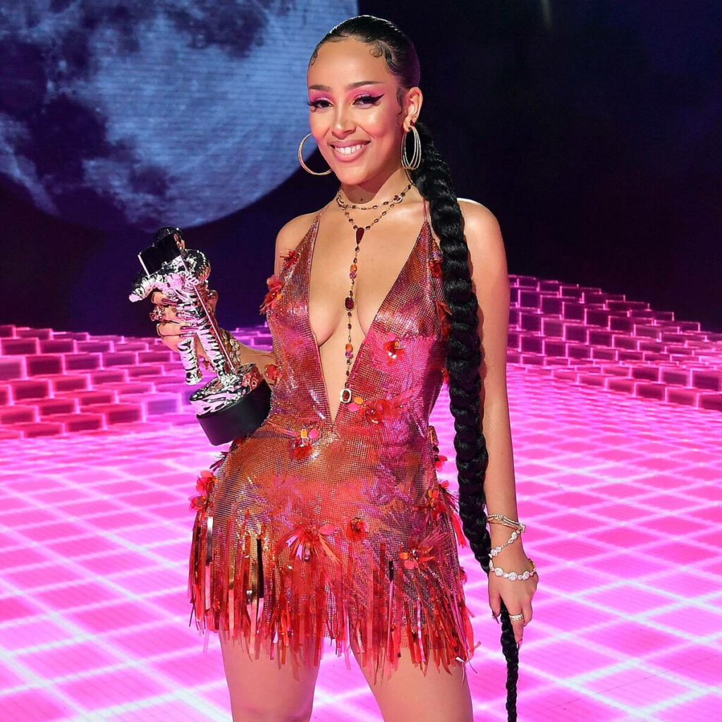 Vibrant Doja Cat Wallpaper: Trophy & Cosmic Neon Pink Background