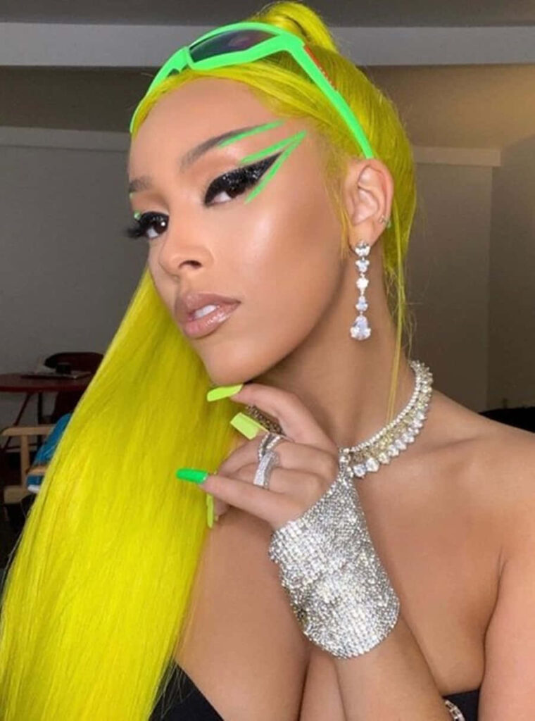 Vibrant Doja Cat Wallpaper: Neon Hair & Bold Makeup Background