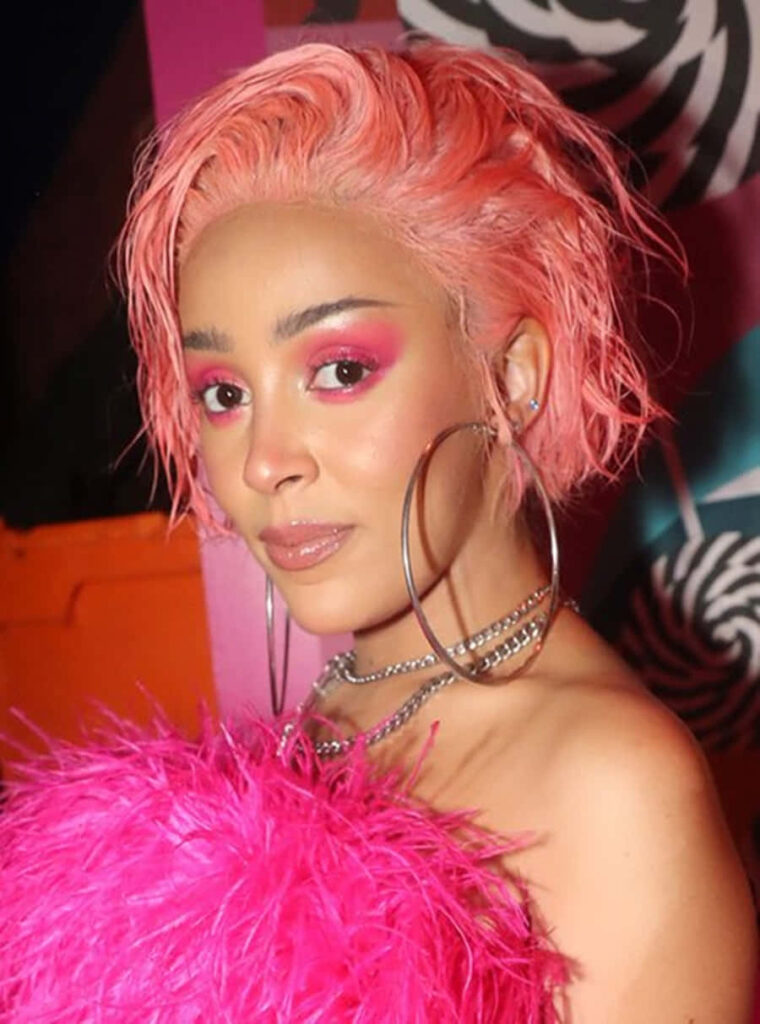 Doja Cat Pink Hair Feathers - Vibrant Wallpaper Background
