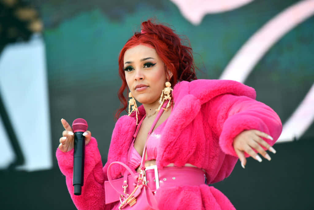 Doja Cat Wallpaper: Vibrant Performance in Stylish Pink Outfit