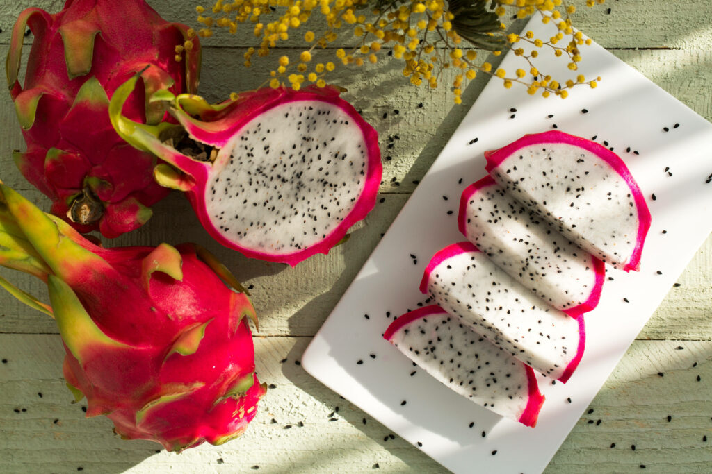 Vibrant Dragonfruit Wallpaper: Fresh Slices & Rustic Background