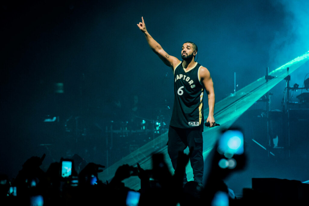 Dynamic Drake Concert Wallpaper: Raptors Jersey & Energetic Crowd