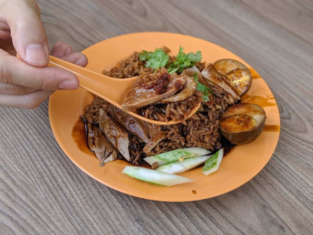 Vibrant Duck Rice Wallpaper: Appetizing Dish on Orange Plate