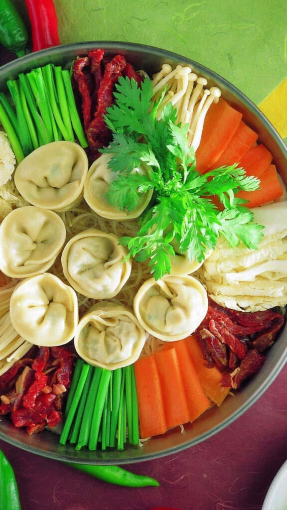 Vibrant Dumpling Wallpaper: Colorful Food Arrangement Background