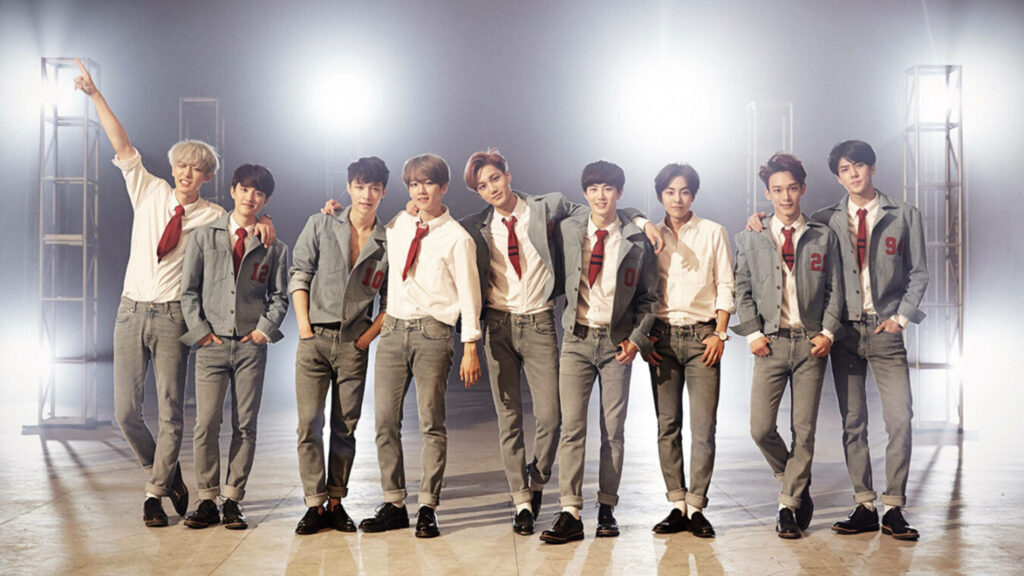 Dynamic EXO Wallpaper: Stylish K-POP Group in Vibrant Uniforms