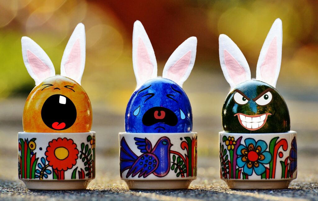 Vibrant Easter Wallpaper: Decorative Eggs with Rabbit Ears & Floral Cups