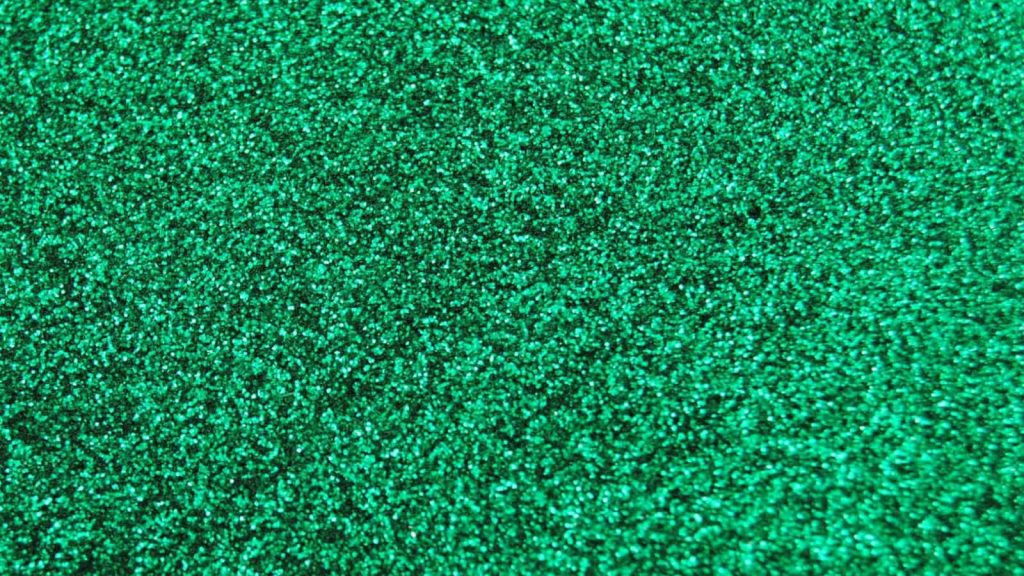 Vibrant emerald green glitter background shimmering with luxury and festive sparkle texture Wallpaper