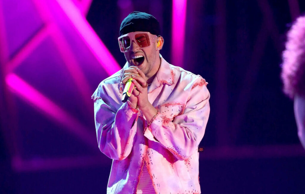 Fierce Pink Fashion: Bad Bunny Dominating the Stage Wallpaper