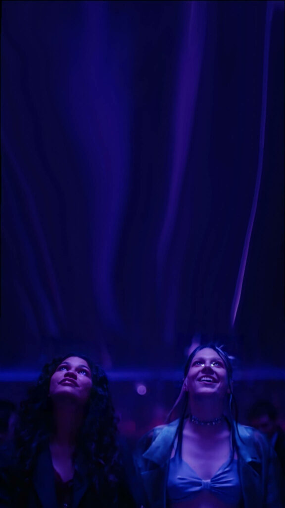 Vibrant Euphoria Wallpaper: Rue & Jules in Dreamy Neon Glow