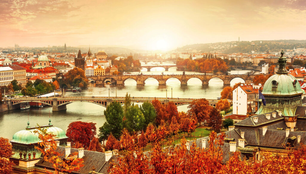 Breathtaking Fall Colors: Historic City & Bridges at Sunset Wallpaper