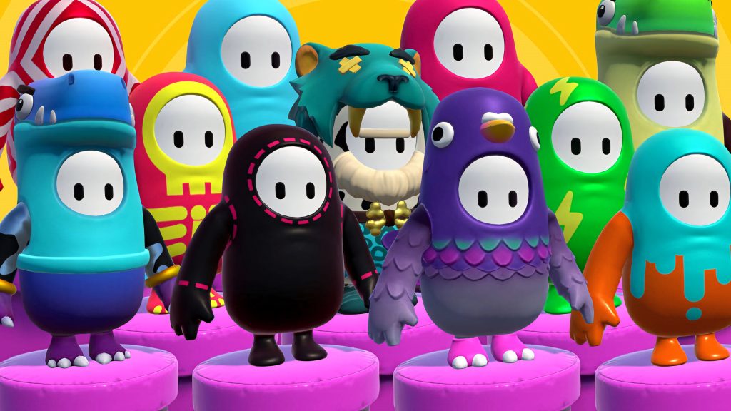 3D Fall Guys characters in colorful skins on pink podiums with bright yellow background wallpaper