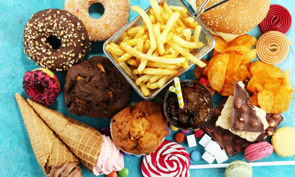 Colorful Fast Food & Desserts Wallpaper on Bright Blue Background