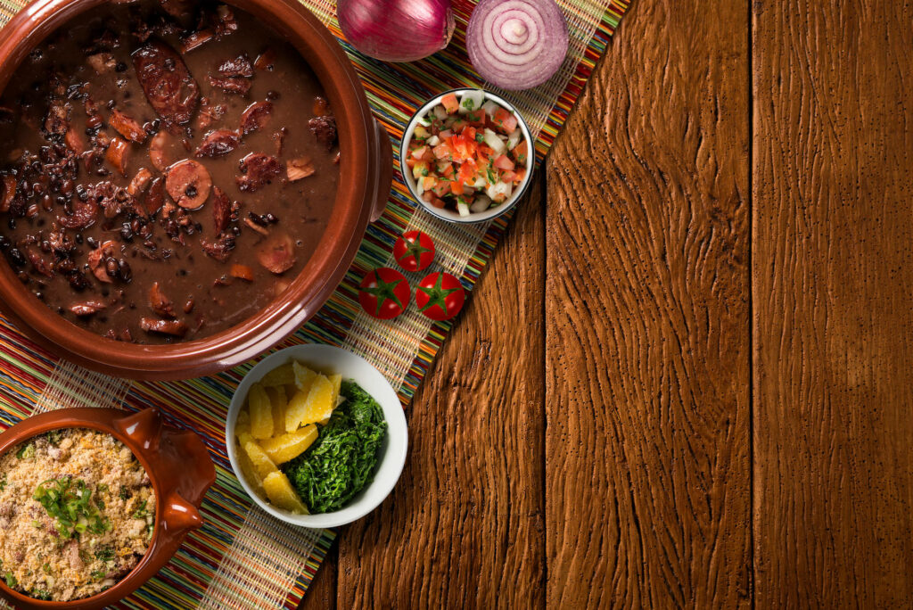 Vibrant Feijoada Wallpaper: Traditional Brazilian Dish & Accompaniments