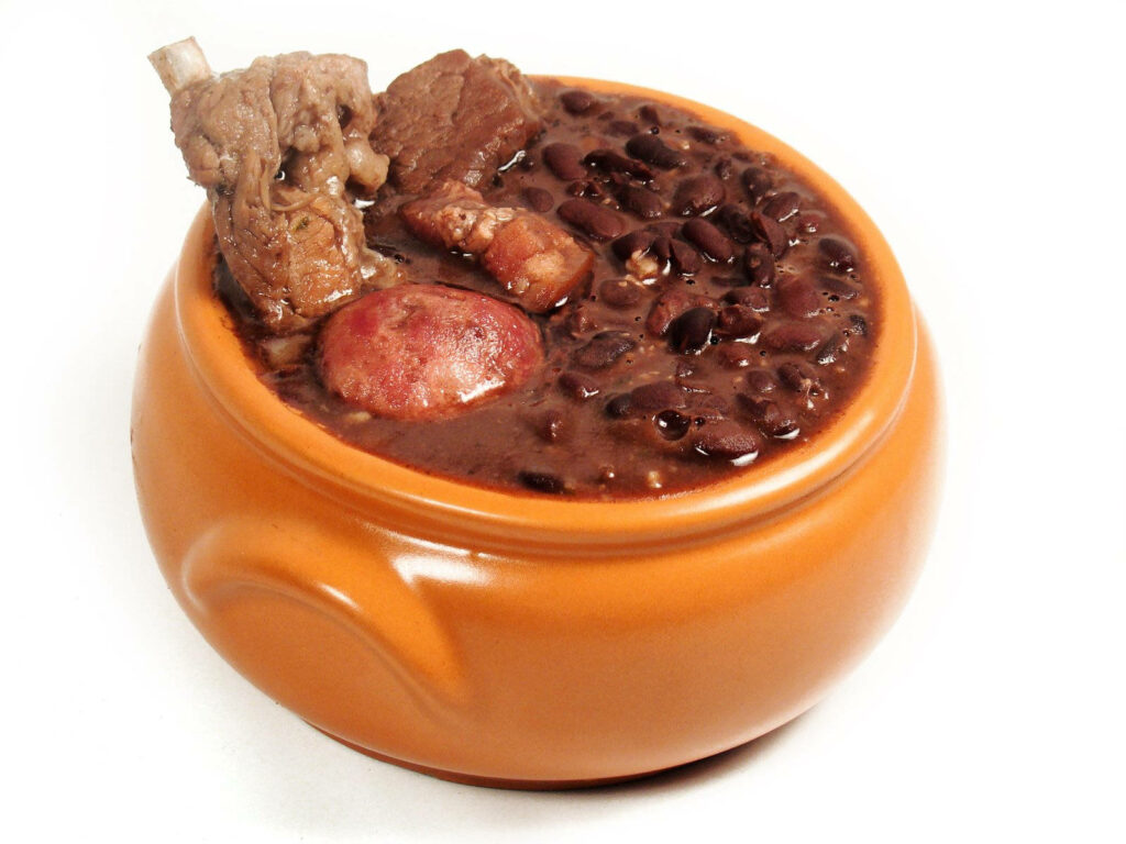 Vibrant Brazilian Feijoada Wallpaper: Rustic Pot & Hearty Ingredients