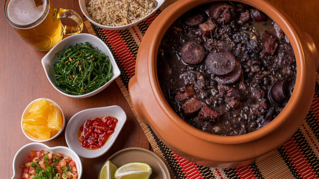 Vibrant Feijoada Soup with Toppings & Beer - Rustic Wallpaper