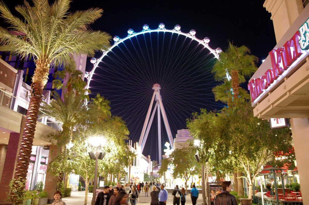 Colorful Ferris Wheel Wallpaper: Lively Night City Scene Background